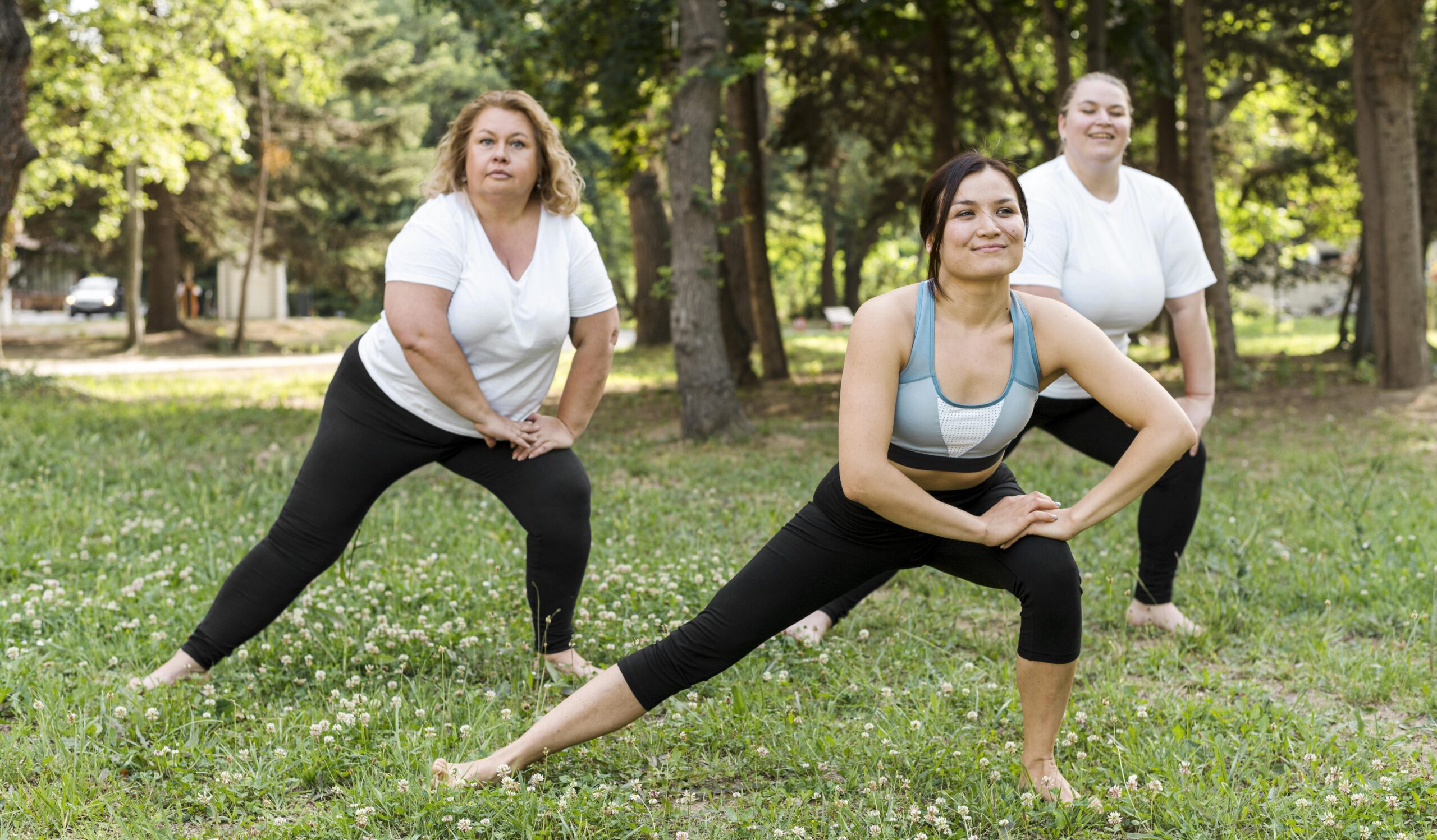 women-doing-lateral-lunges-park (1) women-doing-lateral-lunges-park (1)